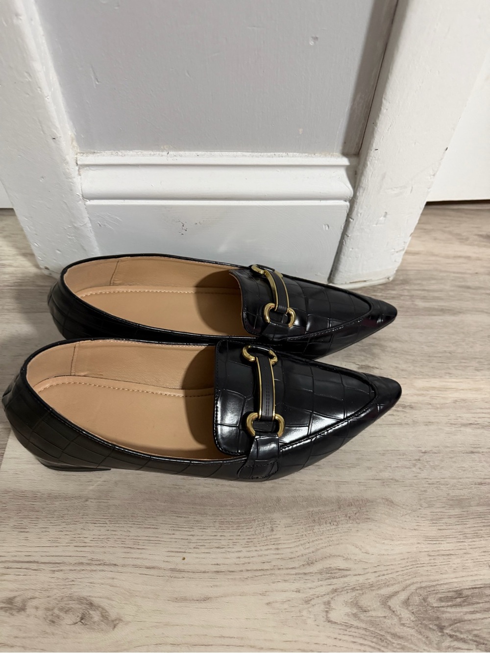 Pointed Black Quilted Loafers with Gold Bit Accent